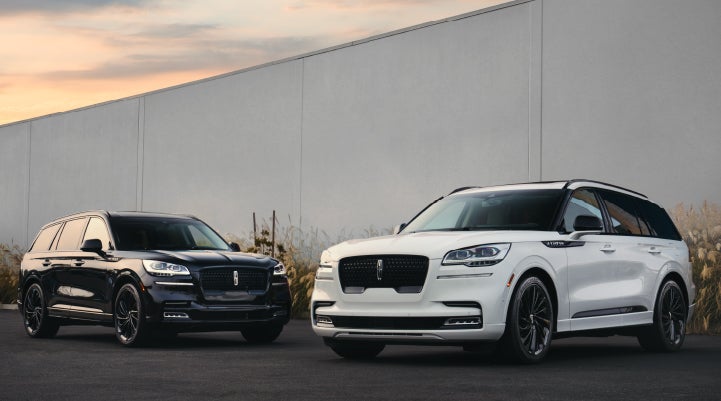 Two Lincoln Aviator® SUVs are shown with the available Jet Appearance Package | Lincoln Demo 5 in Derwood MD