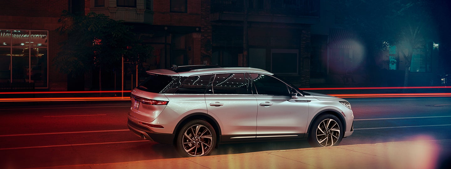 The 2024 Lincoln Corsair® SUV is parked on a city street at night. | Lincoln Demo 5 in Derwood MD