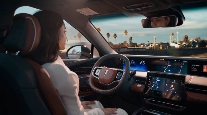 A person is shown driving hands-free on the highway with available Lincoln BlueCruise technology. | Lincoln Demo 5 in Derwood MD