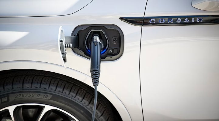 An electric charger is shown plugged into the charging port of a Lincoln Corsair® Grand Touring
model. | Lincoln Demo 5 in Derwood MD
