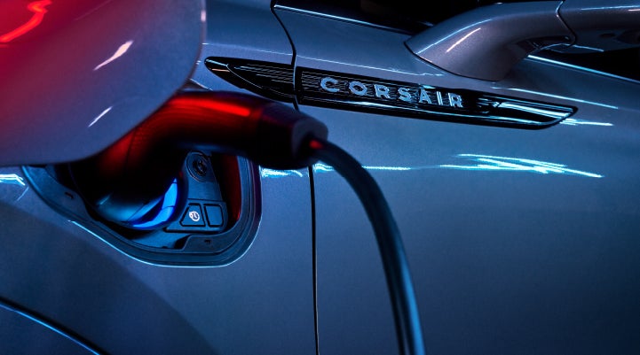 A charger plugged into the charging port of a 2024 Lincoln Corsair® Plug-in Hybrid model. | Lincoln Demo 5 in Derwood MD